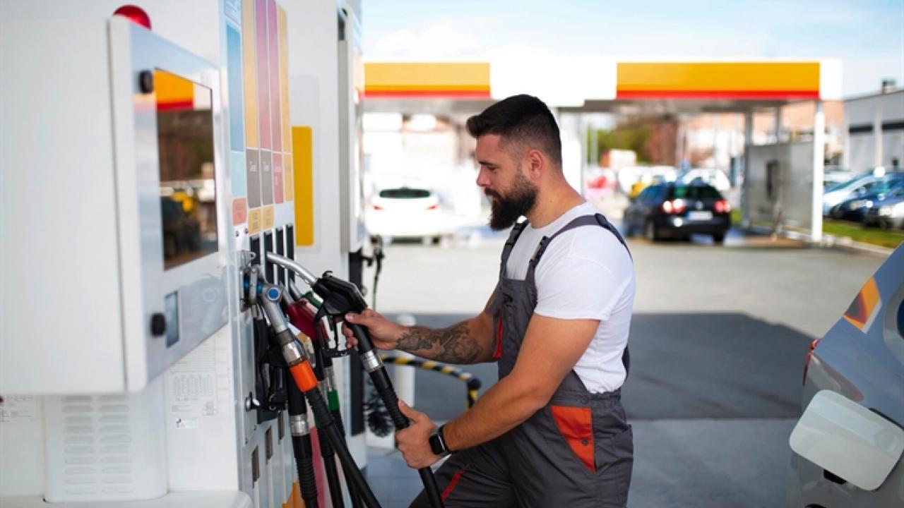 man pumping gas