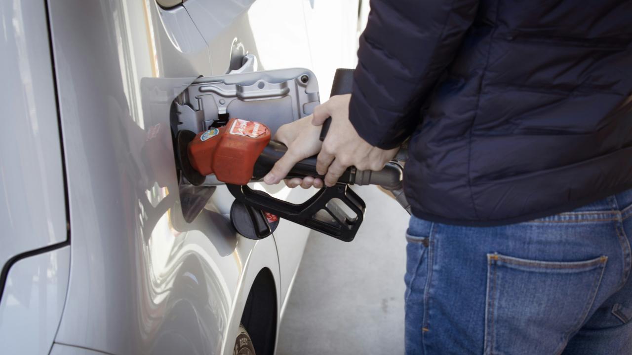 person pumping gas