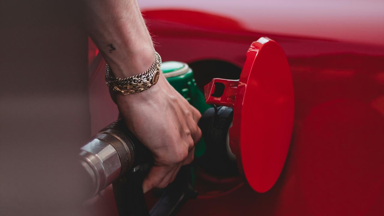 Person putting gas in their car