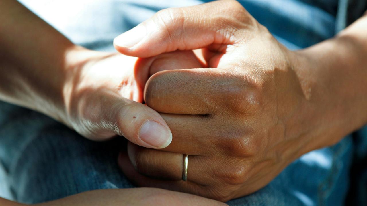 hands clasped together