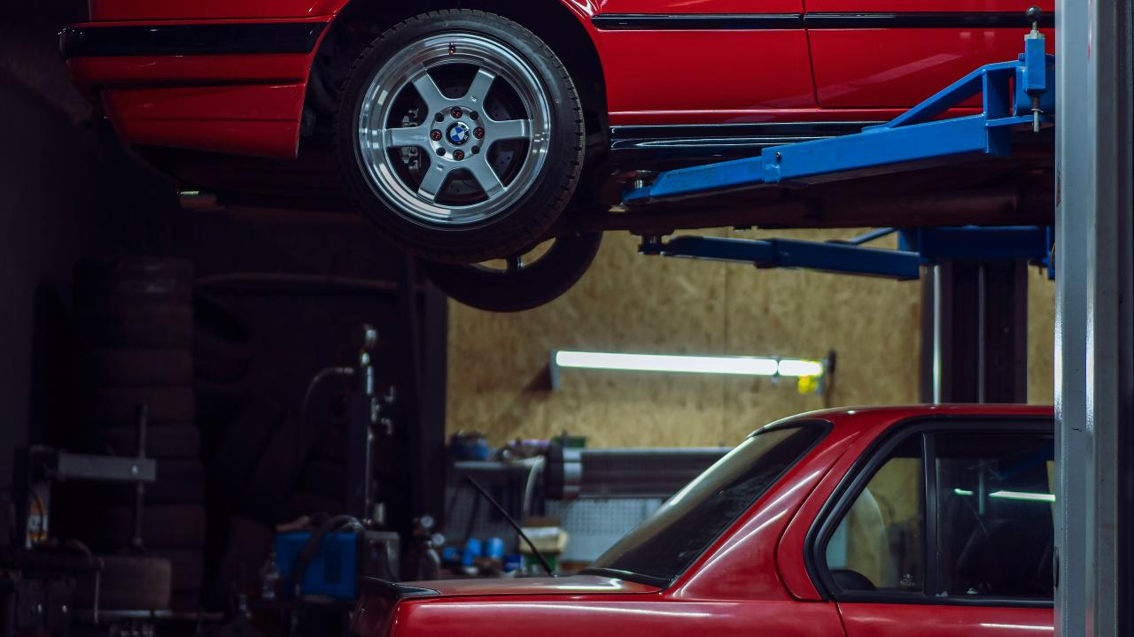 red car on lift
