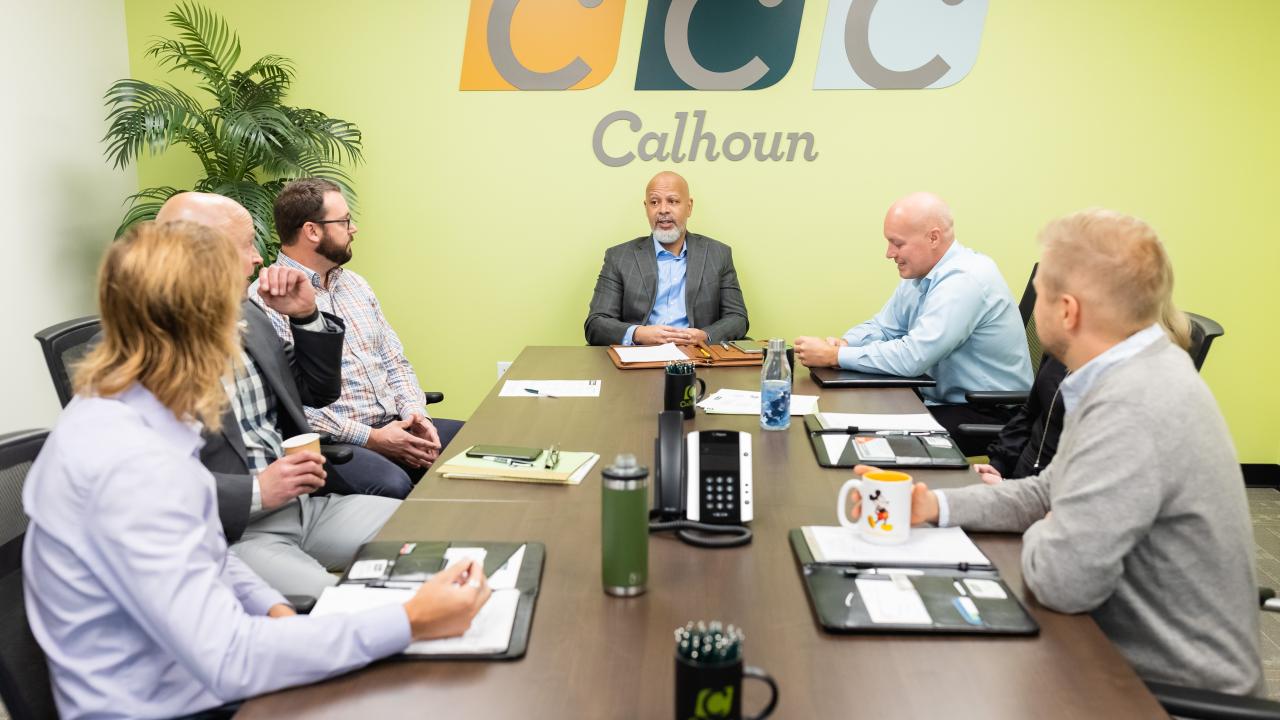 Calhoun Companies agents in a meeting