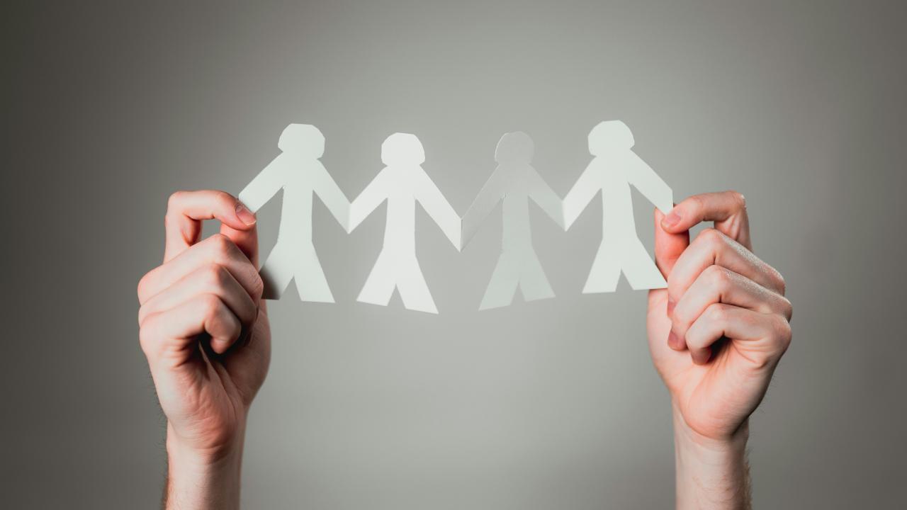 paper cut-outs of small group