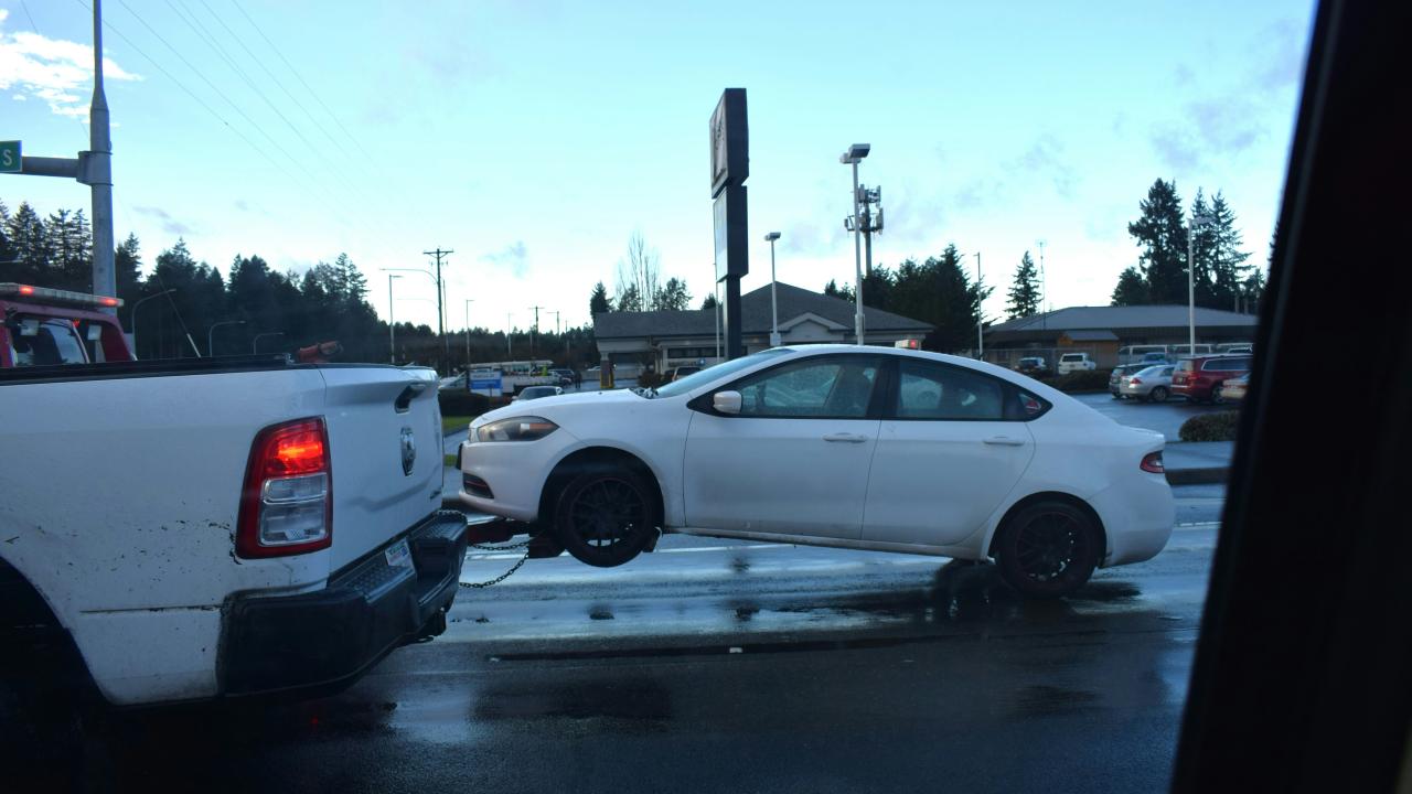 white car being towed