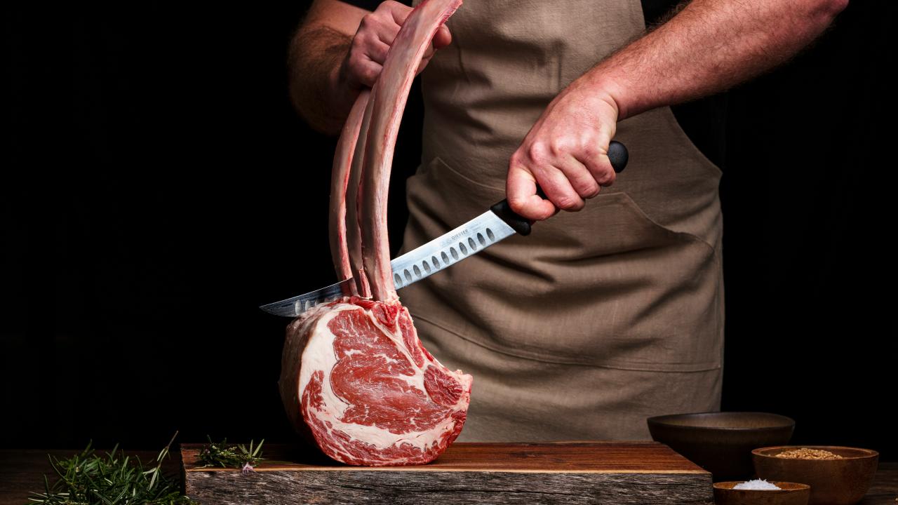 butcher carving meat