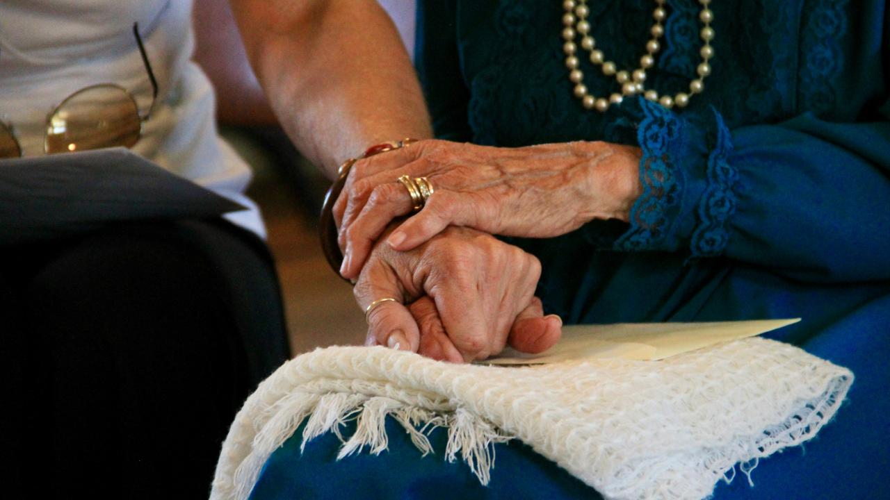 caregiver holding hands